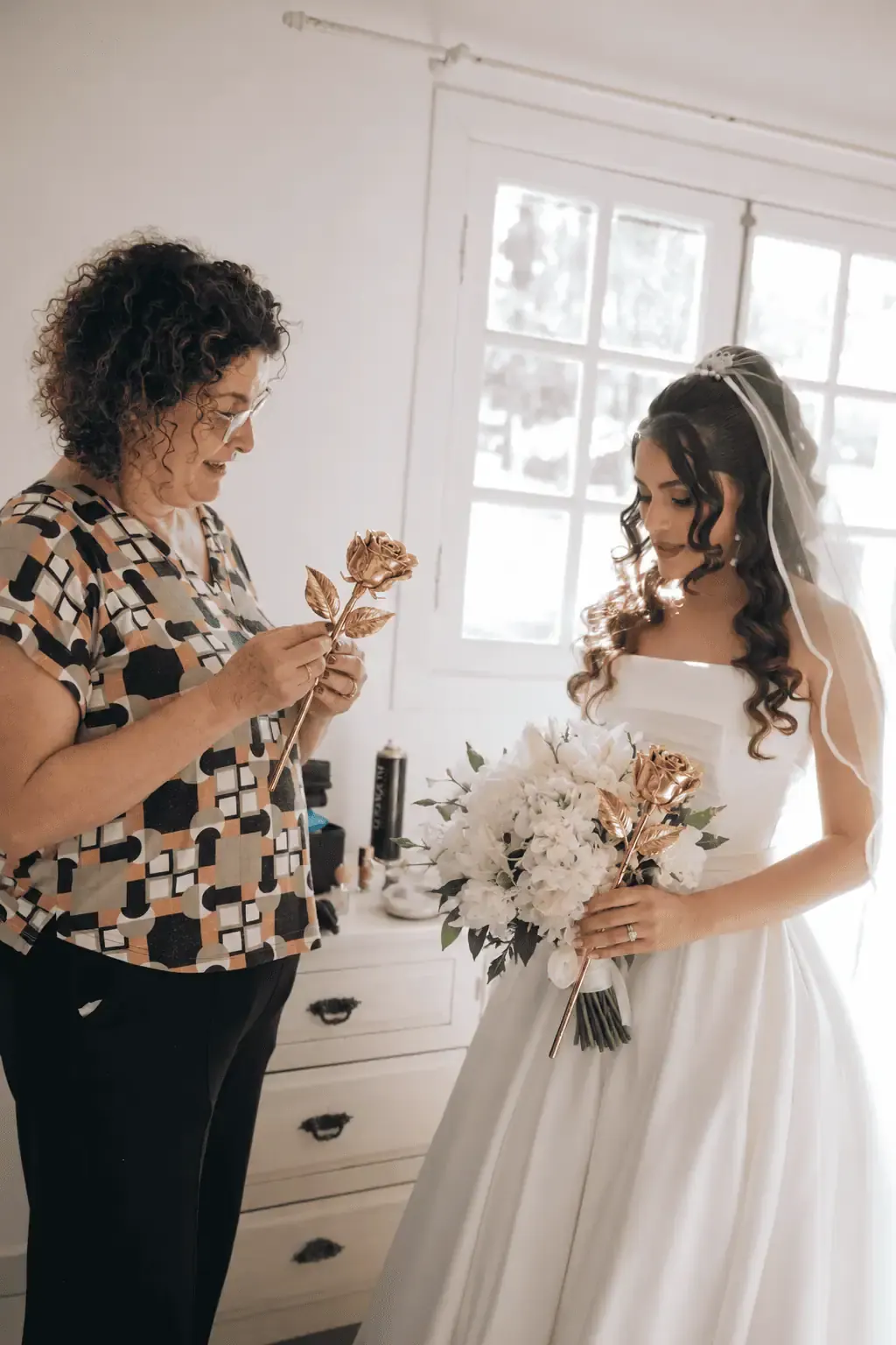 Mother handing a gold dipped rose to the bride on her wedding morning, a gold dipped rose gift idea for London, United Kingdom